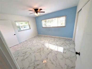 NO FLOOD ZONE-- Move-in ready with major upgrades already on St. Petersburg Country Club in Florida - for sale on GolfHomes.com, golf home, golf lot
