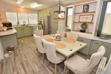 LAND OWNED-NO LAND LEASE This beautifully updated home is on Savanna Golf Club in Florida - for sale on GolfHomes.com, golf home, golf lot