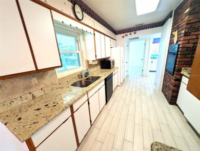 NO FLOOD ZONE-- Move-in ready with major upgrades already on St. Petersburg Country Club in Florida - for sale on GolfHomes.com, golf home, golf lot
