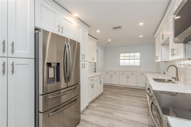 Welcome to 1152 Jackmar Road, a completely renovated 2000sf+ on The Dunedin Country Club in Florida - for sale on GolfHomes.com, golf home, golf lot