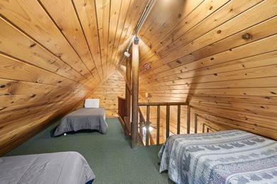 Charming and cozy, this Beaver Creek Resort cabin offers the on The Loon Golf Resort in Michigan - for sale on GolfHomes.com, golf home, golf lot
