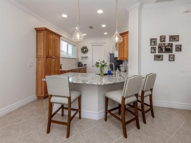 Experience the Florida lifestyle in this elegant Donatello model on Venetian Golf and River Club in Florida - for sale on GolfHomes.com, golf home, golf lot