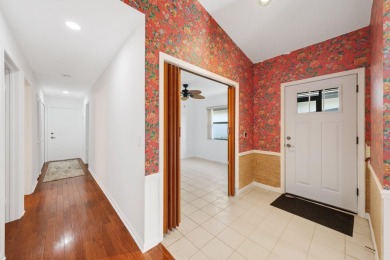 Discover the perfect blend of comfort and convenience within the on PGA National Golf Club in Florida - for sale on GolfHomes.com, golf home, golf lot