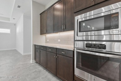 This luxury four bedroom, three bath upgraded home on a wooded on Amelia National Golf and Country Club in Florida - for sale on GolfHomes.com, golf home, golf lot