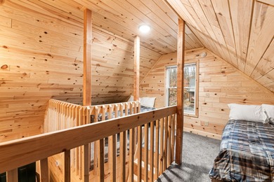 Adorable and inviting, this 2-bedroom, 1-bath Beaver Creek cabin on The Loon Golf Resort in Michigan - for sale on GolfHomes.com, golf home, golf lot