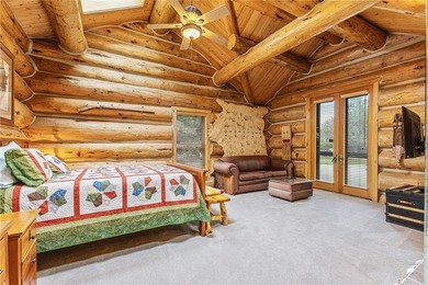 An extraordinary log home surrounded by mature trees and on Red Lodge Golf Club in Montana - for sale on GolfHomes.com, golf home, golf lot