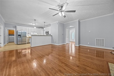 Enjoy outdoor living at its finest with a screened porch on Carolina Lakes Country Club in North Carolina - for sale on GolfHomes.com, golf home, golf lot