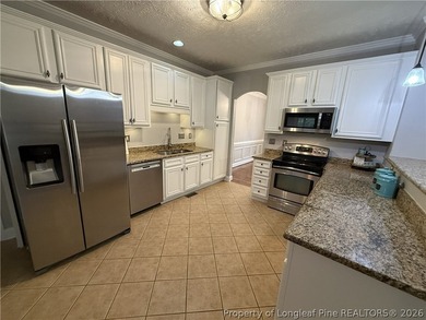 Enjoy outdoor living at its finest with a screened porch on Carolina Lakes Country Club in North Carolina - for sale on GolfHomes.com, golf home, golf lot