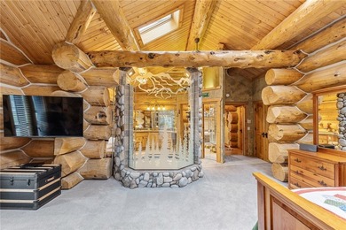 An extraordinary log home surrounded by mature trees and on Red Lodge Golf Club in Montana - for sale on GolfHomes.com, golf home, golf lot
