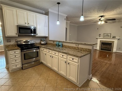 Enjoy outdoor living at its finest with a screened porch on Carolina Lakes Country Club in North Carolina - for sale on GolfHomes.com, golf home, golf lot