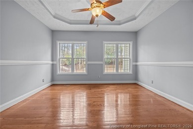 Enjoy outdoor living at its finest with a screened porch on Carolina Lakes Country Club in North Carolina - for sale on GolfHomes.com, golf home, golf lot