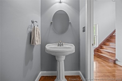 Enjoy outdoor living at its finest with a screened porch on Carolina Lakes Country Club in North Carolina - for sale on GolfHomes.com, golf home, golf lot