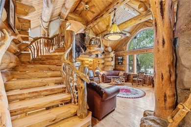 An extraordinary log home surrounded by mature trees and on Red Lodge Golf Club in Montana - for sale on GolfHomes.com, golf home, golf lot