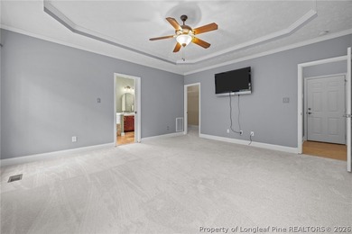 Enjoy outdoor living at its finest with a screened porch on Carolina Lakes Country Club in North Carolina - for sale on GolfHomes.com, golf home, golf lot