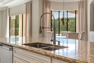 Experience refined, single-level living in this exceptional on The Golden Bear Club At Keenes Pointe in Florida - for sale on GolfHomes.com, golf home, golf lot