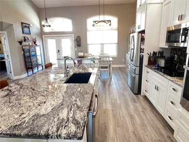 Experience the perfect blend of space, sophistication, and on Pinemoor West Golf Club in Florida - for sale on GolfHomes.com, golf home, golf lot