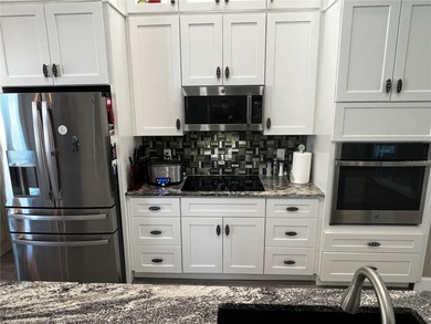 Experience the perfect blend of space, sophistication, and on Pinemoor West Golf Club in Florida - for sale on GolfHomes.com, golf home, golf lot