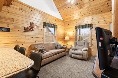 Discover this inviting Beaver Creek Resort cabin, offering the on The Loon Golf Resort in Michigan - for sale on GolfHomes.com, golf home, golf lot
