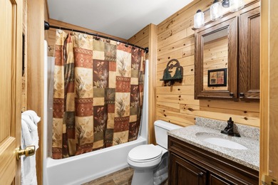 Discover this inviting Beaver Creek Resort cabin, offering the on The Loon Golf Resort in Michigan - for sale on GolfHomes.com, golf home, golf lot