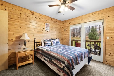 Discover this inviting Beaver Creek Resort cabin, offering the on The Loon Golf Resort in Michigan - for sale on GolfHomes.com, golf home, golf lot