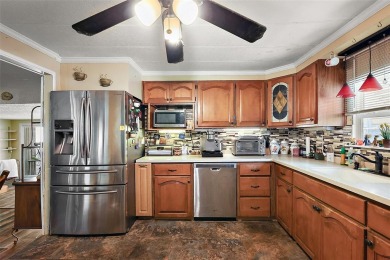 Nestled in the sought after 55+ community of Imperial Terrace on Bay Tree Golf Course in Florida - for sale on GolfHomes.com, golf home, golf lot
