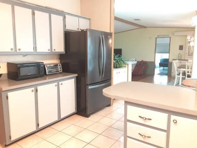 This waterfront 1792 sq ft 3 bedroom manufactured home is in 55+ on Schalamar Creek Golf and Country Club in Florida - for sale on GolfHomes.com, golf home, golf lot