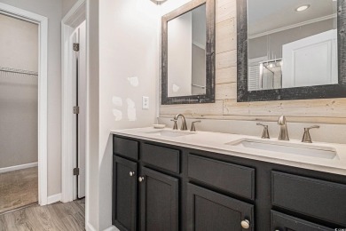 Set on a desirable corner lot, this spacious 4-bedroom, 3-bath on Myrtle Beach National Golf Course in South Carolina - for sale on GolfHomes.com, golf home, golf lot