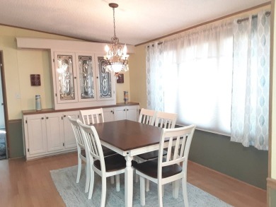 This waterfront 1792 sq ft 3 bedroom manufactured home is in 55+ on Schalamar Creek Golf and Country Club in Florida - for sale on GolfHomes.com, golf home, golf lot