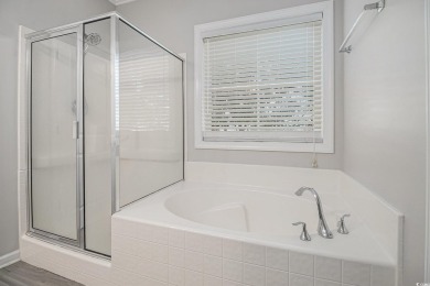 Set on a desirable corner lot, this spacious 4-bedroom, 3-bath on Myrtle Beach National Golf Course in South Carolina - for sale on GolfHomes.com, golf home, golf lot