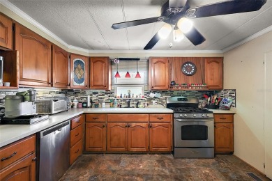 Nestled in the sought after 55+ community of Imperial Terrace on Bay Tree Golf Course in Florida - for sale on GolfHomes.com, golf home, golf lot