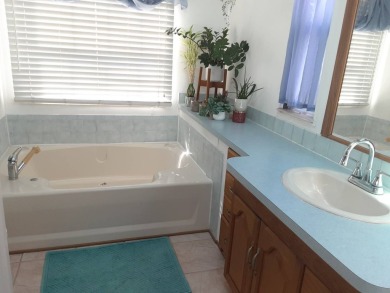 This waterfront 1792 sq ft 3 bedroom manufactured home is in 55+ on Schalamar Creek Golf and Country Club in Florida - for sale on GolfHomes.com, golf home, golf lot
