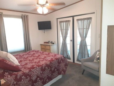 This waterfront 1792 sq ft 3 bedroom manufactured home is in 55+ on Schalamar Creek Golf and Country Club in Florida - for sale on GolfHomes.com, golf home, golf lot