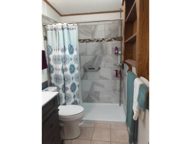 This waterfront 1792 sq ft 3 bedroom manufactured home is in 55+ on Schalamar Creek Golf and Country Club in Florida - for sale on GolfHomes.com, golf home, golf lot