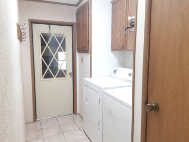 This waterfront 1792 sq ft 3 bedroom manufactured home is in 55+ on Schalamar Creek Golf and Country Club in Florida - for sale on GolfHomes.com, golf home, golf lot