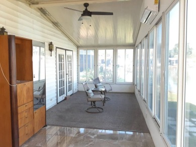 This waterfront 1792 sq ft 3 bedroom manufactured home is in 55+ on Schalamar Creek Golf and Country Club in Florida - for sale on GolfHomes.com, golf home, golf lot
