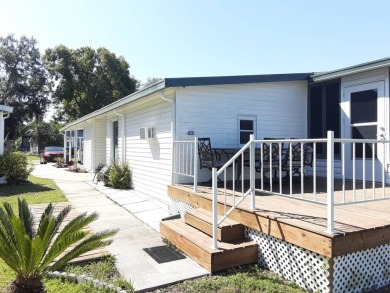 This waterfront 1792 sq ft 3 bedroom manufactured home is in 55+ on Schalamar Creek Golf and Country Club in Florida - for sale on GolfHomes.com, golf home, golf lot