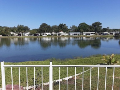 This waterfront 1792 sq ft 3 bedroom manufactured home is in 55+ on Schalamar Creek Golf and Country Club in Florida - for sale on GolfHomes.com, golf home, golf lot