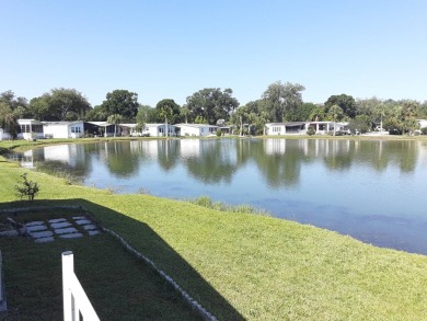 This waterfront 1792 sq ft 3 bedroom manufactured home is in 55+ on Schalamar Creek Golf and Country Club in Florida - for sale on GolfHomes.com, golf home, golf lot