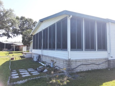 This waterfront 1792 sq ft 3 bedroom manufactured home is in 55+ on Schalamar Creek Golf and Country Club in Florida - for sale on GolfHomes.com, golf home, golf lot