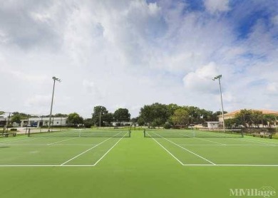 This waterfront 1792 sq ft 3 bedroom manufactured home is in 55+ on Schalamar Creek Golf and Country Club in Florida - for sale on GolfHomes.com, golf home, golf lot