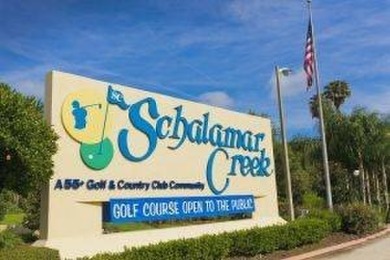 This waterfront 1792 sq ft 3 bedroom manufactured home is in 55+ on Schalamar Creek Golf and Country Club in Florida - for sale on GolfHomes.com, golf home, golf lot