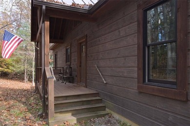 Nestled in the serene beauty of the North Georgia mountains on White Path Golf Club in Georgia - for sale on GolfHomes.com, golf home, golf lot