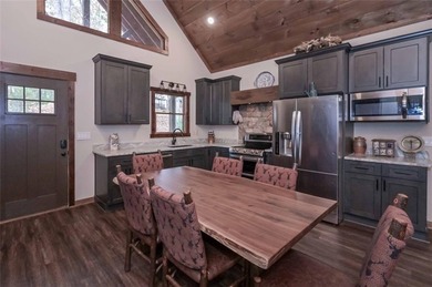 Nestled in the serene beauty of the North Georgia mountains on White Path Golf Club in Georgia - for sale on GolfHomes.com, golf home, golf lot