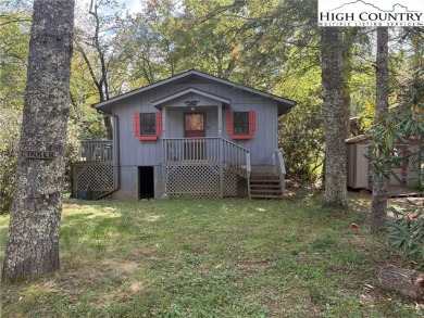Two bedroom, one bath home on the Linville River. Trout fish out on Land Harbor Golf Course in North Carolina - for sale on GolfHomes.com, golf home, golf lot
