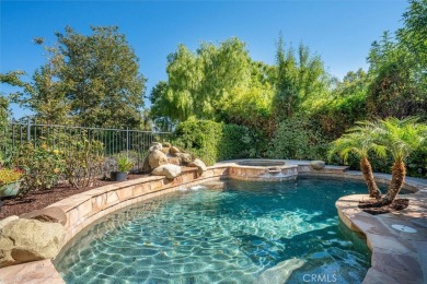 This Valencia Woodlands Ironwood pool home offers a rare large on Valencia Country Club in California - for sale on GolfHomes.com, golf home, golf lot