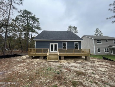 NEW CONSTRUCTION!! Welcome to a beautiful 5 bedroom, 3 1/2 on Woodlake Country Club in North Carolina - for sale on GolfHomes.com, golf home, golf lot