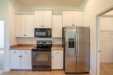 Beautiful 4-bedroom, 3-bathroom home on an oversized lot in on The Grand Club Cypress Course in Florida - for sale on GolfHomes.com, golf home, golf lot