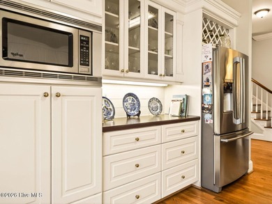 Situated on a quiet cul-de-sac overlooking the 9th tee of on Greenville Country Club in North Carolina - for sale on GolfHomes.com, golf home, golf lot