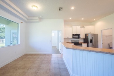Beautiful 4-bedroom, 3-bathroom home on an oversized lot in on The Grand Club Cypress Course in Florida - for sale on GolfHomes.com, golf home, golf lot
