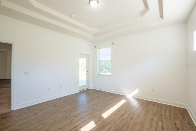 Beautiful 4-bedroom, 3-bathroom home on an oversized lot in on The Grand Club Cypress Course in Florida - for sale on GolfHomes.com, golf home, golf lot